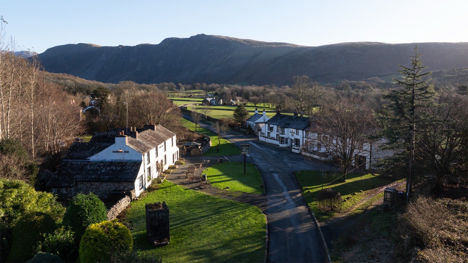 Aerial view of Nether Wasdale valley, with The Strands and The Screes inns on the road below Wasdale's fells